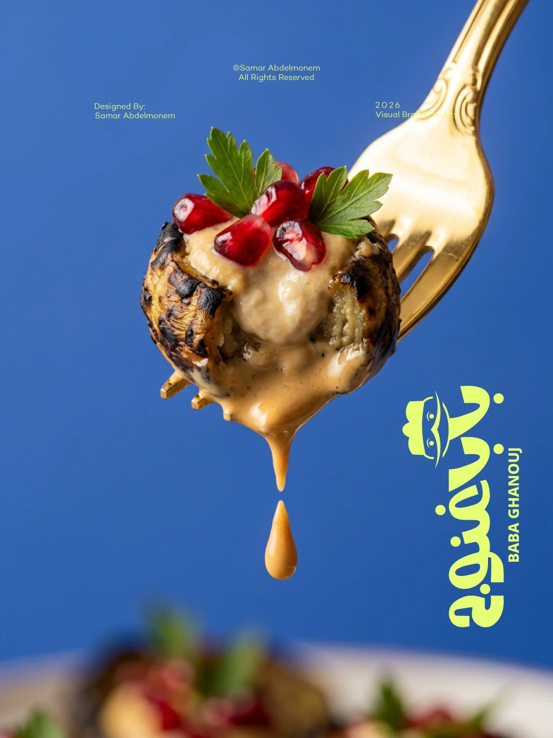 Grilled aubergine with tahini and pomegranate on a gold fork, logo set vertically